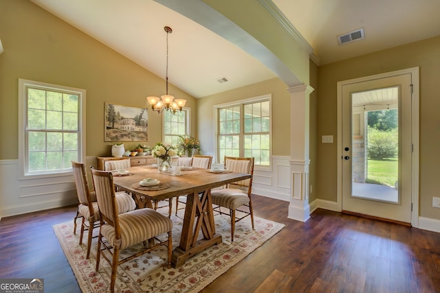 70 Country Meadows Ln, Covington, GA 30014 - dining area with dark wood-style flooring, wainscoting, arched walkways, lofted ceiling, and a chandelier