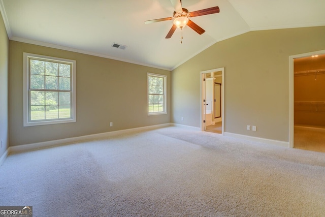 70 Country Meadows Ln, Covington, GA 30014 - unfurnished bedroom with baseboards, lofted ceiling, a walk in closet, carpet, and crown molding