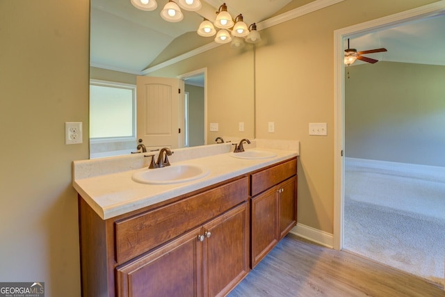 70 Country Meadows Ln, Covington, GA 30014 - bathroom with vaulted ceiling, crown molding, double vanity, baseboards, and ceiling fan