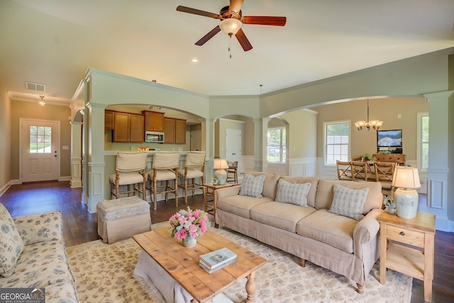 70 Country Meadows Ln, Covington, GA 30014 - living area featuring ornate columns, arched walkways, a ceiling fan, healthy amount of natural light, and crown molding