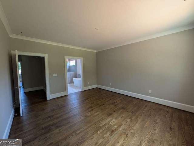 8239 High Lake Ter, Covington, GA 30014 - empty room featuring dark wood-type flooring, baseboards, and ornamental molding