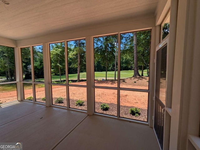 8239 High Lake Ter, Covington, GA 30014 - unfurnished sunroom featuring view of wooded area