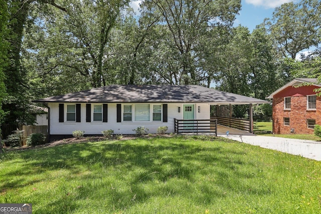 623 Montevista St SW, Atlanta, GA 30310 - view of front of house featuring brick siding, concrete driveway, and a carport