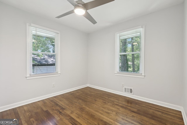 623 Montevista St SW, Atlanta, GA 30310 - unfurnished room featuring baseboards, dark wood-type flooring, and a ceiling fan