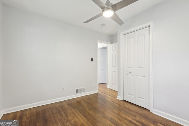 623 Montevista St SW, Atlanta, GA 30310 - unfurnished bedroom featuring baseboards, dark wood finished floors, a closet, and ceiling fan