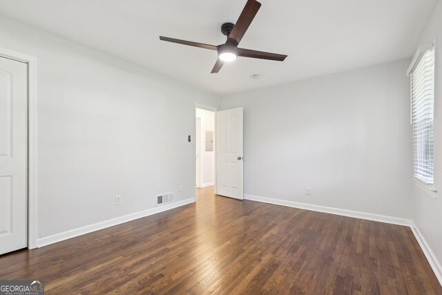 623 Montevista St SW, Atlanta, GA 30310 - unfurnished bedroom with dark wood-style flooring, baseboards, and ceiling fan