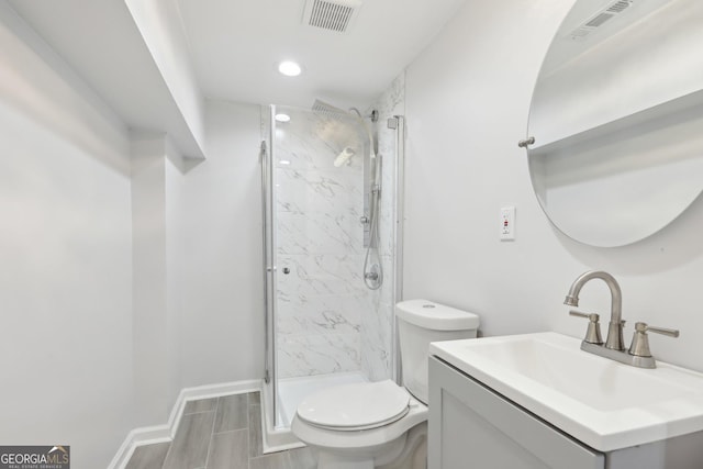 623 Montevista St SW, Atlanta, GA 30310 - full bath with a marble finish shower, toilet, vanity, baseboards, and recessed lighting