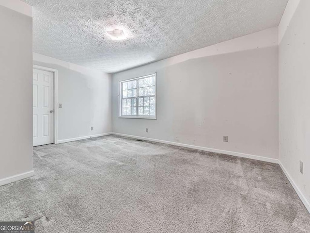 301 Jetta Ln, Canton, GA 30115 - carpeted empty room with a textured ceiling and baseboards