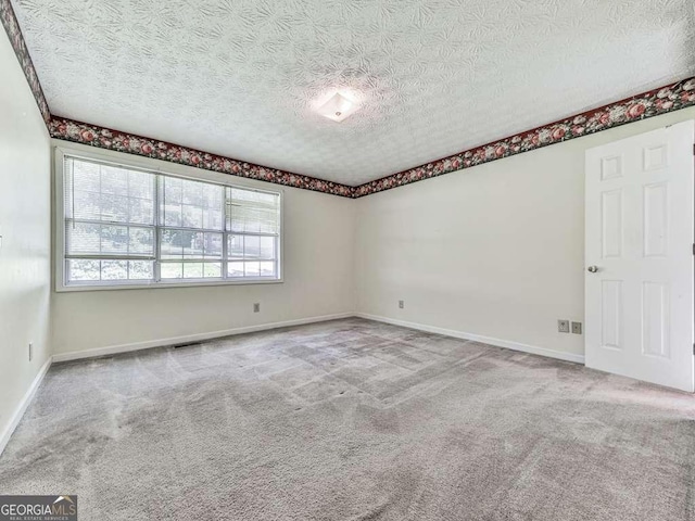 301 Jetta Ln, Canton, GA 30115 - empty room featuring a textured ceiling, carpet floors, and baseboards