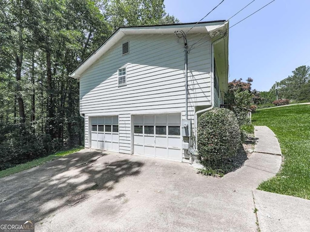 301 Jetta Ln, Canton, GA 30115 - view of side of property featuring an attached garage and concrete driveway