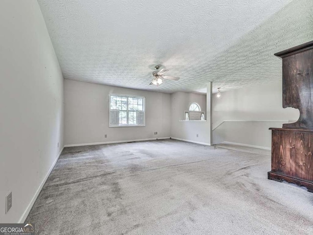 301 Jetta Ln, Canton, GA 30115 - unfurnished room featuring a textured ceiling, ceiling fan, carpet floors, and baseboards