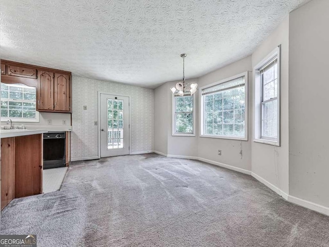301 Jetta Ln, Canton, GA 30115 - unfurnished dining area featuring a chandelier, baseboards, plenty of natural light, light carpet, and a textured ceiling