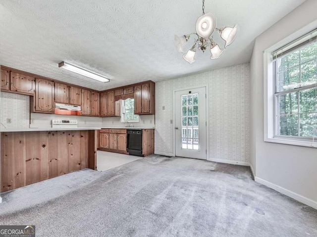 301 Jetta Ln, Canton, GA 30115 - kitchen with black dishwasher, a chandelier, under cabinet range hood, light countertops, and plenty of natural light
