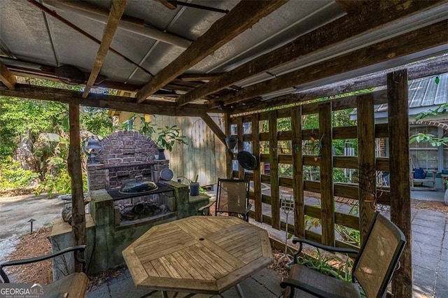 3 Stewart Ave, Saint Simons, GA 31522 - wooden deck featuring a patio and an outdoor fireplace