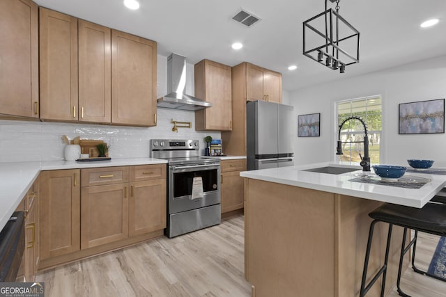 2014 Fence Rd, Dacula, GA 30019 - kitchen featuring wall chimney exhaust hood, appliances with stainless steel finishes, a sink, light wood-style flooring, and backsplash
