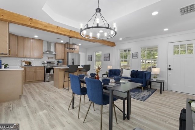 2014 Fence Rd, Dacula, GA 30019 - dining space featuring healthy amount of natural light, light wood-style flooring, a chandelier, and recessed lighting