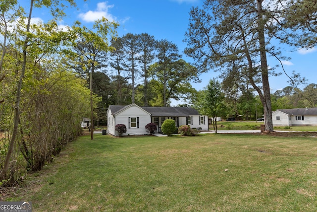 2014 Fence Rd, Dacula, GA 30019 - view of front facade with a front yard