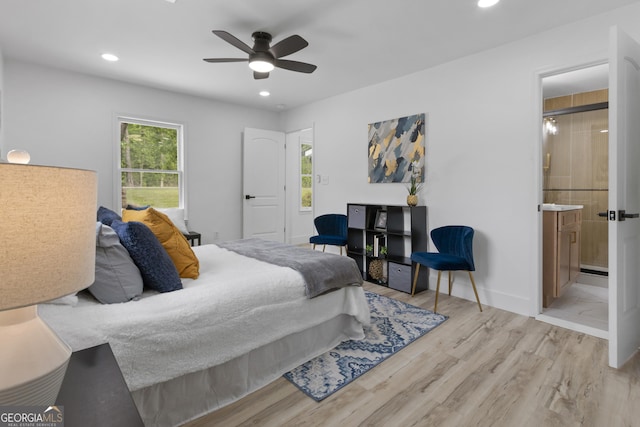 2014 Fence Rd, Dacula, GA 30019 - bedroom with wood finished floors, recessed lighting, connected bathroom, a ceiling fan, and baseboards