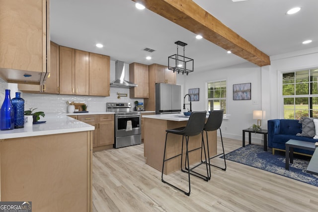 2014 Fence Rd, Dacula, GA 30019 - kitchen featuring stainless steel appliances, wall chimney range hood, plenty of natural light, beamed ceiling, and light wood-type flooring