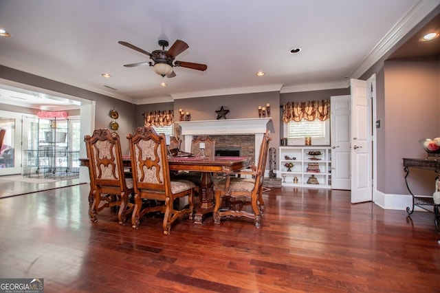 1050 Denton Rd, Douglasville, GA 30134 - dining room with wood finished floors, ceiling fan, crown molding, a fireplace, and recessed lighting