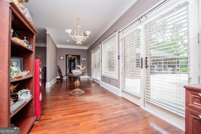 1050 Denton Rd, Douglasville, GA 30134 - dining room with crown molding, a chandelier, baseboards, and wood finished floors