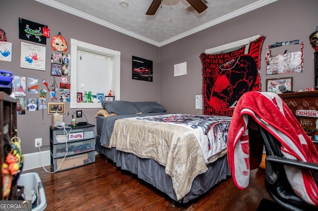 1050 Denton Rd, Douglasville, GA 30134 - bedroom with wood finished floors, ornamental molding, a textured ceiling, and a ceiling fan