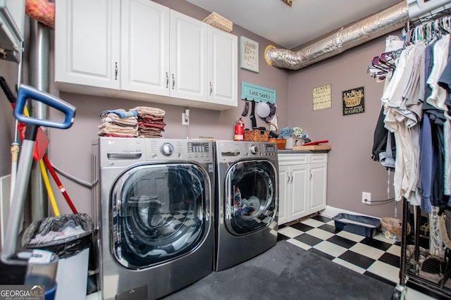 1050 Denton Rd, Douglasville, GA 30134 - laundry area with cabinet space, independent washer and dryer, and tile patterned floors