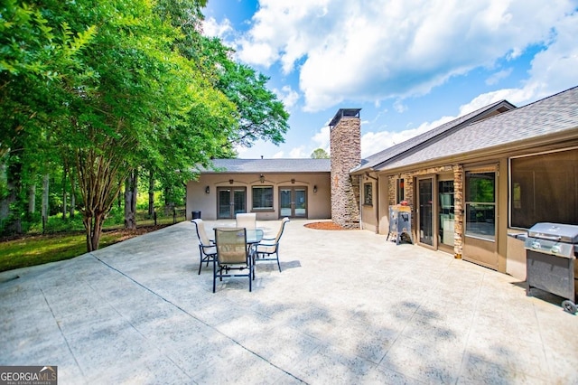 1050 Denton Rd, Douglasville, GA 30134 - view of patio featuring french doors, outdoor dining space, and grilling area