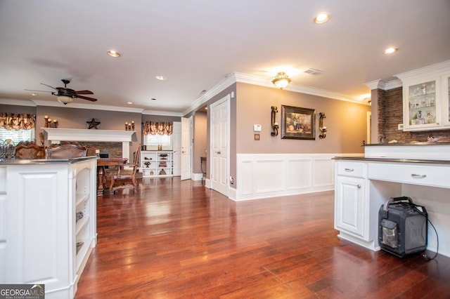 1050 Denton Rd, Douglasville, GA 30134 - kitchen featuring a ceiling fan, dark wood finished floors, white cabinets, ornamental molding, and glass insert cabinets