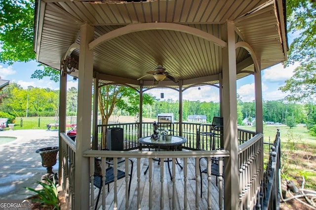 1050 Denton Rd, Douglasville, GA 30134 - wooden deck featuring a ceiling fan and view of scattered trees