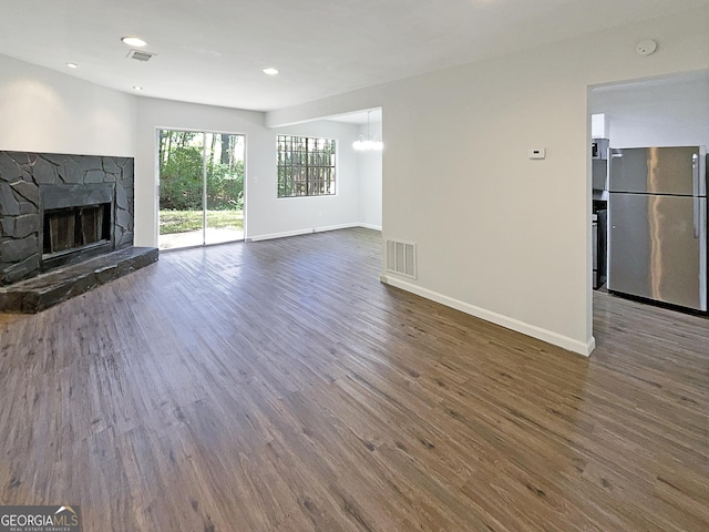 3008 Pine Tree Trl # 16D, South Fulton, GA 30349 - unfurnished living room with dark wood-type flooring, baseboards, a fireplace, a chandelier, and recessed lighting