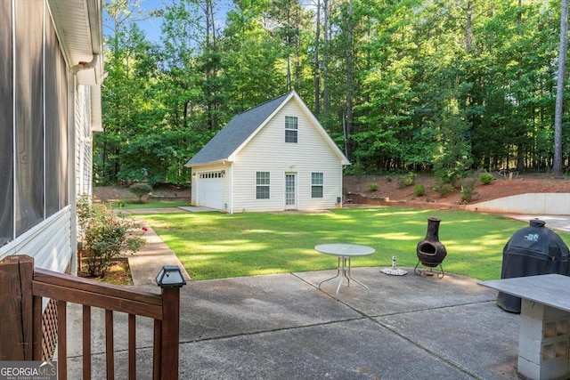 413 Tuxedo Dr, Commerce, GA 30530 - view of patio featuring an outbuilding and a garage