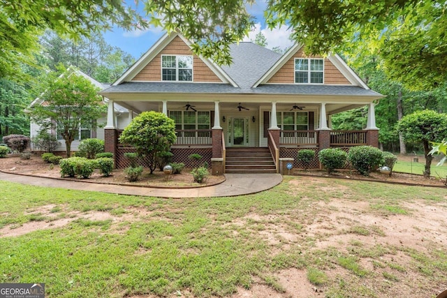 413 Tuxedo Dr, Commerce, GA 30530 - craftsman house with a ceiling fan, a shingled roof, covered porch, and a front yard