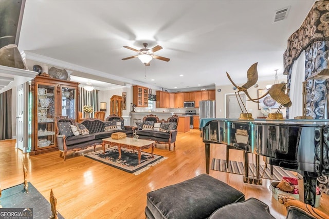413 Tuxedo Dr, Commerce, GA 30530 - living area featuring ceiling fan, crown molding, light wood finished floors, and recessed lighting