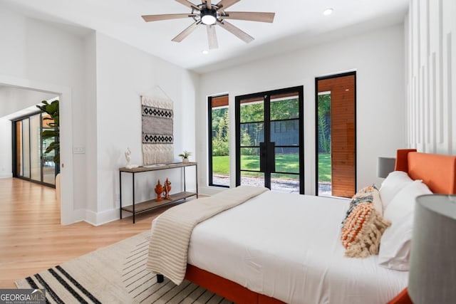 5370 Greenleaf Dr SW, Mableton, GA 30126 - bedroom featuring wood finished floors, baseboards, recessed lighting, french doors, and access to exterior