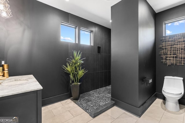 5370 Greenleaf Dr SW, Mableton, GA 30126 - full bathroom featuring toilet, walk in shower, vanity, plenty of natural light, and recessed lighting