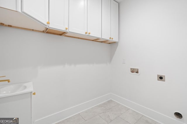 5370 Greenleaf Dr SW, Mableton, GA 30126 - laundry area featuring cabinet space, electric dryer hookup, hookup for a washing machine, and baseboards