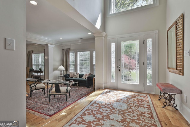 1000 Pleasance Grv, Peachtree City, GA 30269 - foyer with decorative columns, plenty of natural light, hardwood / wood-style floors, ornamental molding, and recessed lighting