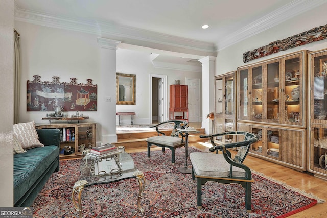 1000 Pleasance Grv, Peachtree City, GA 30269 - living area with decorative columns, wood finished floors, crown molding, recessed lighting, and baseboards