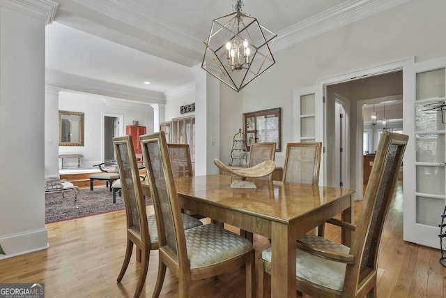 1000 Pleasance Grv, Peachtree City, GA 30269 - dining room featuring a chandelier, light wood-style flooring, crown molding, built in shelves, and recessed lighting
