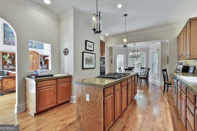 1000 Pleasance Grv, Peachtree City, GA 30269 - kitchen with brown cabinets, light wood-type flooring, recessed lighting, and crown molding