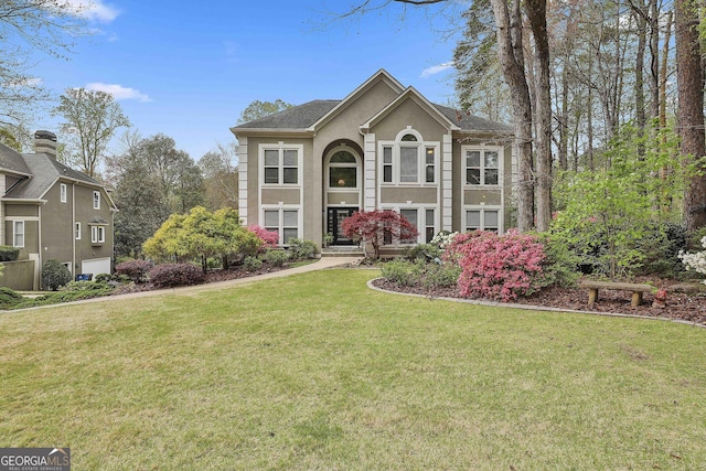 1000 Pleasance Grv, Peachtree City, GA 30269 - view of front facade with stucco siding and a front lawn