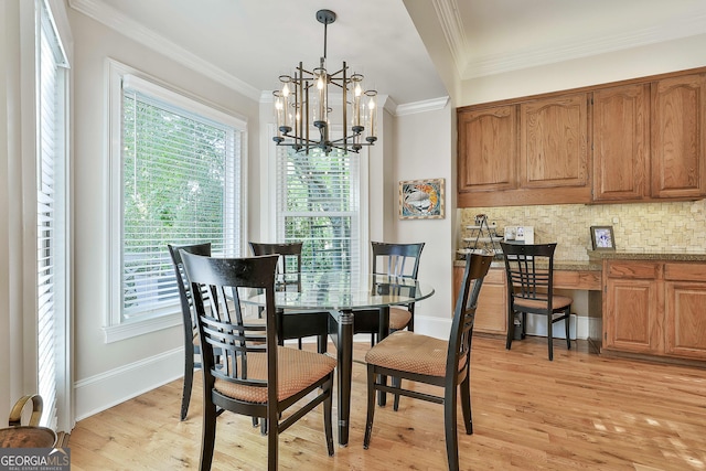1000 Pleasance Grv, Peachtree City, GA 30269 - dining space featuring a chandelier, light wood-type flooring, baseboards, and crown molding