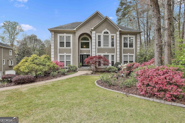 1000 Pleasance Grv, Peachtree City, GA 30269 - view of front facade with stucco siding and a front lawn