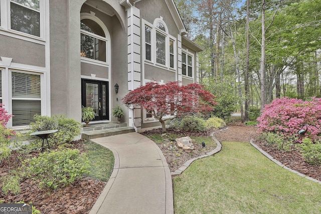 1000 Pleasance Grv, Peachtree City, GA 30269 - view of exterior entry with stucco siding and a yard