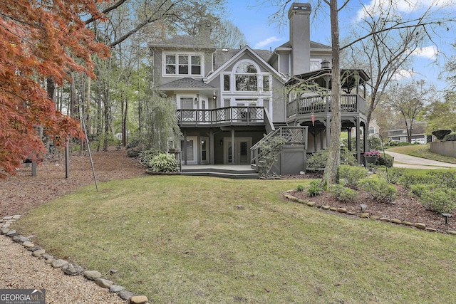 1000 Pleasance Grv, Peachtree City, GA 30269 - back of property with a wooden deck, a lawn, stairs, and a chimney