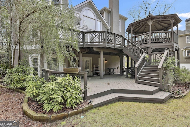 1000 Pleasance Grv, Peachtree City, GA 30269 - rear view of house featuring a wooden deck and stucco siding
