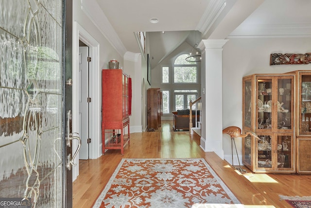 1000 Pleasance Grv, Peachtree City, GA 30269 - entryway featuring decorative columns, light wood-style floors, ornamental molding, stairs, and baseboards