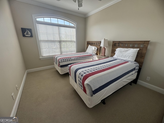 306 Reserve Ln, Saint Simons, GA 31522 - carpeted bedroom featuring ornamental molding, baseboards, and a ceiling fan
