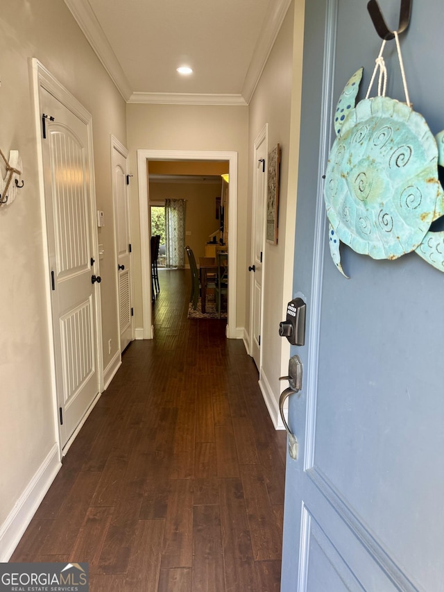 306 Reserve Ln, Saint Simons, GA 31522 - hall with dark wood finished floors, ornamental molding, baseboards, and recessed lighting